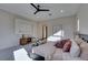 Main bedroom features a ceiling fan, a stylish dresser, and neutral decor at 6009 Silvalde Ln, Las Vegas, NV 89135