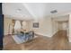 Elegant dining room with modern lighting, hardwood floors, and views of the backyard, creating an inviting atmosphere for meals at 6021 Vista Clara St, Las Vegas, NV 89148