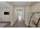 Inviting hallway boasting hardwood floors, neutral paint, and open sightlines with a display shelf at 6021 Vista Clara St, Las Vegas, NV 89148