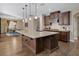 Modern kitchen showcasing a granite island, stainless steel appliances, and hardwood floors at 6021 Vista Clara St, Las Vegas, NV 89148