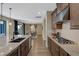 Kitchen featuring granite countertops, stainless steel appliances, and hardwood flooring at 6021 Vista Clara St, Las Vegas, NV 89148