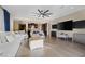 Bright living room features hardwood floors and an open layout, seamlessly connecting to the modern kitchen and dining areas at 6021 Vista Clara St, Las Vegas, NV 89148