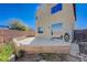 Backyard featuring a concrete patio area with a partial fence and minimal landscaping at 608 Breezy Sage Ct, Henderson, NV 89015