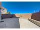 View of the backyard with large patio and block perimeter wall at 608 Breezy Sage Ct, Henderson, NV 89015