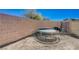 Backyard with a trampoline and brick perimeter wall at 608 Breezy Sage Ct, Henderson, NV 89015