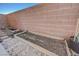 Backyard featuring a raised garden bed and rock landscaping at 608 Breezy Sage Ct, Henderson, NV 89015