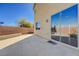 View of the backyard with a large patio and sliding glass door at 608 Breezy Sage Ct, Henderson, NV 89015