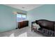 Neutral-toned bedroom with a large window overlooking the neighborhood at 608 Breezy Sage Ct, Henderson, NV 89015