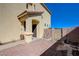 Inviting entryway with covered porch, desert landscaping, and convenient side gate at 608 Breezy Sage Ct, Henderson, NV 89015