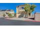 Inviting two-story house boasts an attached garage, mature tree, and well-kept surroundings at 608 Breezy Sage Ct, Henderson, NV 89015