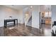 Open concept living room featuring hardwood floors, a staircase and view into the kitchen at 608 Breezy Sage Ct, Henderson, NV 89015