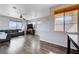 Bright living room with hardwood floors, neutral walls, and large windows at 608 Breezy Sage Ct, Henderson, NV 89015