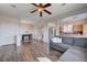 Open floor plan living room with dark wood floors, neutral walls, and natural light at 608 Breezy Sage Ct, Henderson, NV 89015