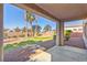 Backyard featuring a covered patio, gravel, grass, and a block wall at 6337 Black Mane Way, North Las Vegas, NV 89081