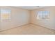 Bedroom featuring two windows with blinds for natural light and privacy at 6337 Black Mane Way, North Las Vegas, NV 89081