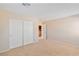 Bedroom featuring a closet with sliding doors and neutral paint at 6337 Black Mane Way, North Las Vegas, NV 89081