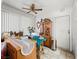 A spacious dining area featuring a ceiling fan, a cabinet, bright natural light, and tile floors at 6630 Bubbling Brook Dr # C, Las Vegas, NV 89107