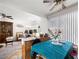 Cozy dining area with a ceiling fan, bright natural light, and vintage-style decor at 6630 Bubbling Brook Dr # C, Las Vegas, NV 89107