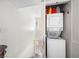 A convenient laundry area with a stacked washer and dryer unit in an enclosed space at 6630 Bubbling Brook Dr # C, Las Vegas, NV 89107