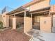 This cozy patio area has brick fencing and a shade cover, ideal for outdoor seating and relaxation at 6630 Bubbling Brook Dr # C, Las Vegas, NV 89107