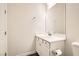 A clean and bright bathroom with white vanity, fixtures, and decor at 668 Look Lively Ct, Henderson, NV 89011