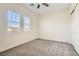 Neutral bedroom with carpet, shutters, and a ceiling fan at 668 Look Lively Ct, Henderson, NV 89011