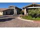 Exterior of the beautiful clubhouse with a welcoming entrance and well-manicured landscaping at 668 Look Lively Ct, Henderson, NV 89011