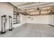 Spacious two-car garage featuring installed storage shelving, utility system, and epoxy flooring at 668 Look Lively Ct, Henderson, NV 89011