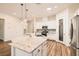 Beautiful kitchen featuring a granite island, stainless steel appliances, and lots of counter space at 668 Look Lively Ct, Henderson, NV 89011