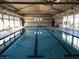 Indoor swimming pool with lane markers, perfect for exercise and recreation at 668 Look Lively Ct, Henderson, NV 89011