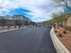 Gated community entrance with decorative ironwork and attractive landscaping at 6988 Sylmar Ave, Las Vegas, NV 89113