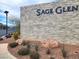 Stone community sign for Sage Glen with attractive rock and desert landscaping at 6988 Sylmar Ave, Las Vegas, NV 89113