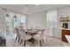 Dining room featuring a modern table, comfortable chairs, and natural light at 6988 Sylmar Ave, Las Vegas, NV 89113