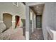 Inviting covered entryway with tiled pathway, pillars, and a modern front door with decorative hardware at 6988 Sylmar Ave, Las Vegas, NV 89113