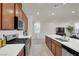 Modern kitchen featuring stainless steel appliances, quartz countertops, and a gas range at 6988 Sylmar Ave, Las Vegas, NV 89113