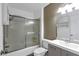 Well-lit bathroom featuring a shower-tub combo with sliding glass door, and a modern vanity with white countertop at 7100 Pirates Cove Rd # 2067, Las Vegas, NV 89145