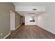 Open-concept living room with wood floors leading into a view of the kitchen at 7100 Pirates Cove Rd # 2067, Las Vegas, NV 89145