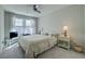 This bedroom features neutral colors, a ceiling fan, and bright natural light at 720 Sleeping City Ave, Henderson, NV 89015