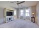 Spacious bedroom showcasing a TV console, plush carpeting, and bright windows at 720 Sleeping City Ave, Henderson, NV 89015