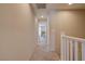 Hallway with neutral walls, carpet flooring, and doors leading to various rooms at 720 Sleeping City Ave, Henderson, NV 89015