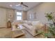 Cozy living room with a comfortable white sofa, modern lighting, and stylish decor at 720 Sleeping City Ave, Henderson, NV 89015