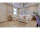 Bright and airy living room with a white sectional sofa and modern fixtures at 720 Sleeping City Ave, Henderson, NV 89015