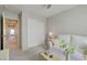 Bright sitting room features white sofa, side table and sliding-door closet with carpet floors at 720 Sleeping City Ave, Henderson, NV 89015