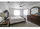 Bedroom featuring decorative lamps, and a large mirror and dresser at 7400 Wheat Grass Ct, Las Vegas, NV 89129