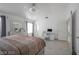 Bedroom features a decorative light, modern furnishings, and a vaulted ceiling at 7400 Wheat Grass Ct, Las Vegas, NV 89129