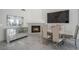 Bright dining area featuring a fireplace, mirrored console and elegant furnishings at 7400 Wheat Grass Ct, Las Vegas, NV 89129