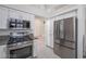 This modern kitchen features white cabinets, granite countertops, and stainless steel appliances at 7400 Wheat Grass Ct, Las Vegas, NV 89129