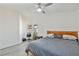 Bedroom with two windows, hardwood floors, a ceiling fan, and natural light at 7436 Lattimore Dr, Las Vegas, NV 89128