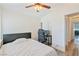 Bedroom with wood floors, a modern ceiling fan, closet, and doorway to other areas of the home at 7436 Lattimore Dr, Las Vegas, NV 89128