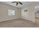 Bedroom with a ceiling fan, large window, and pre-installed TV wall mount at 7701 W Robindale Rd # 102, Las Vegas, NV 89113